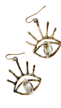 Load image into Gallery viewer, Brass eye shaped earrings and necklace each with a crystal quartz in the center and displayed on a white background with crystals strewn about.